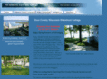 sandbaycottage.com