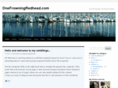 onefrowningredhead.com